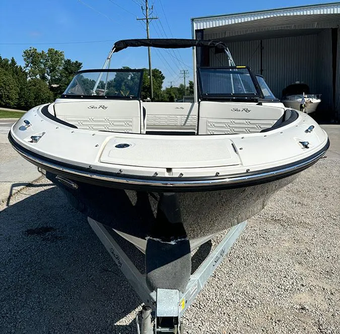 Slide: The Image of 2024 Sea Ray SPX 210 boat on a trailer, front view. - 2
