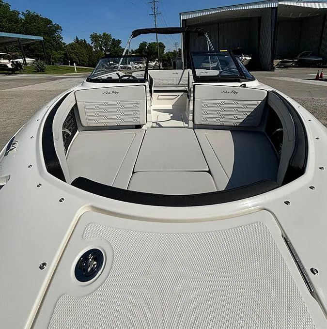 Slide: The Image of 2024 Sea Ray SPX 210 boat with spacious seating and modern design. - 20