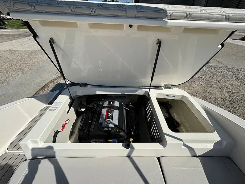 Slide: The Image of 2024 Sea Ray SPX 210 boat engine compartment with open hatch. - 21