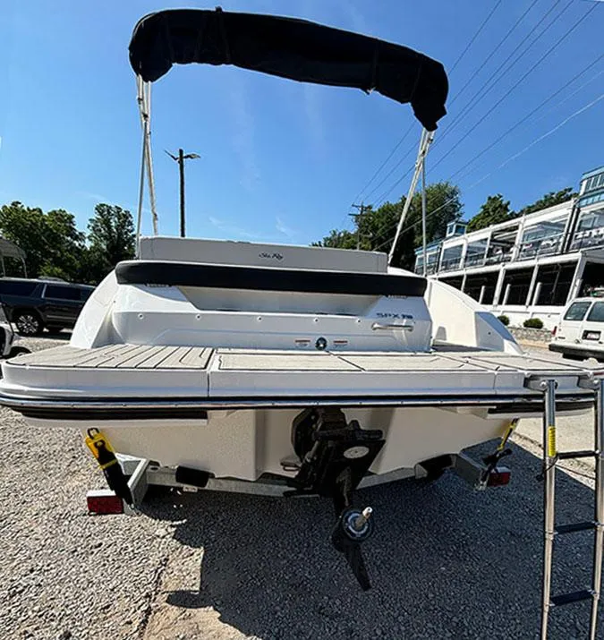 Slide: The Image of 2024 Sea Ray SPX 210 boat with black canopy, rear view. - 3
