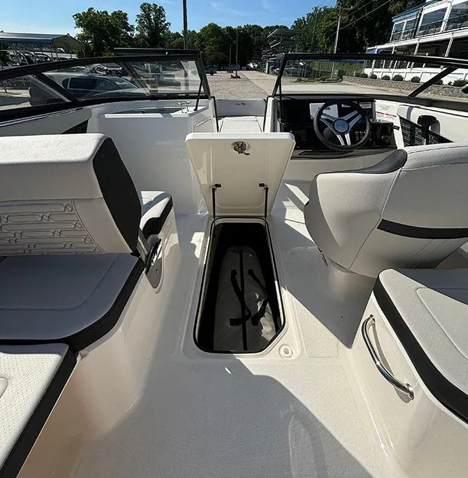 Slide: The Image of 2024 Sea Ray SPX 210 boat interior with open storage compartment. - 5