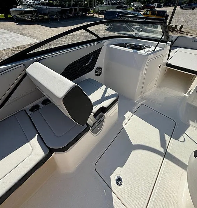 Slide: The Image of 2024 Sea Ray SPX 210 boat interior with seating and storage compartments. - 6