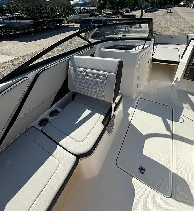 Slide: The Image of 2024 Sea Ray SPX 210 boat interior with seating and cup holders. - 7
