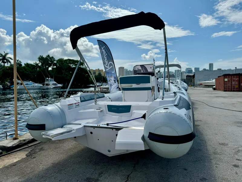 Slide: The Image of 2023 Ranieri CAYMAN 21 SPORT boat docked by the waterfront. - 16