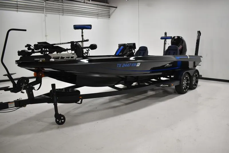 Slide: The Image of 2023 iKon LX21 fishing boat with trailer in a showroom. - 1