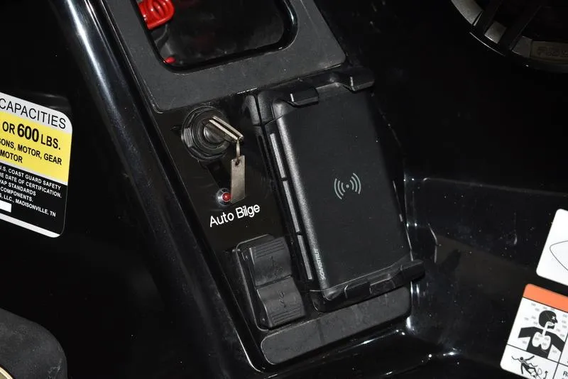 Slide: The Image of Control panel of iKon LX21 boat, featuring auto bilge switch and wireless charging pad. - 10