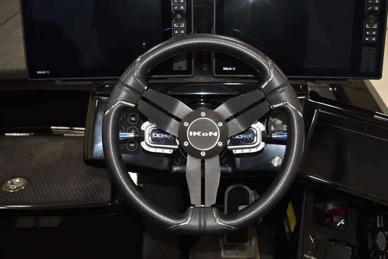 Slide: The Image of iKon LX21 2023 model steering wheel with dashboard and control panels. - 12