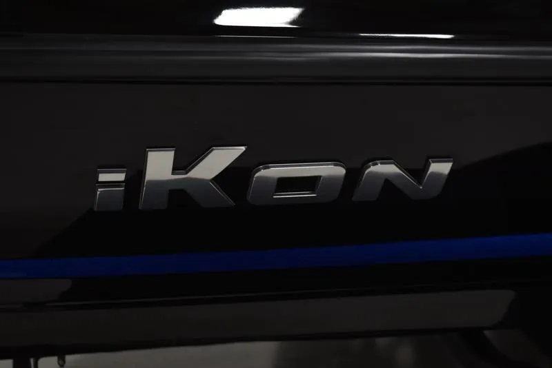 Slide: The Image of iKon LX21 2023 model logo on a black vehicle. - 13