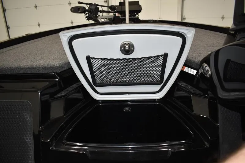 Slide: The Image of 2023 iKon LX21 boat storage compartment with netted pocket. - 14