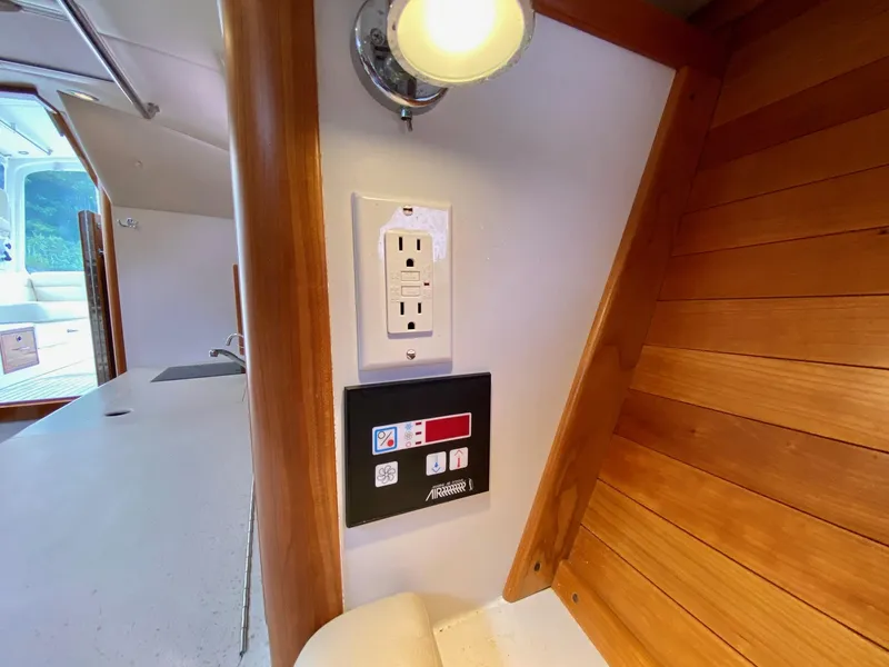 Slide: The Image of Compact kitchen area in 2013 MJM 36z Downeast boat with sink, stove, and microwave. - 23