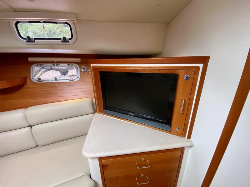 Slide: The Image of 2013 MJM 36z Downeast yacht interior with open wooden cabinet and drawers. - 25