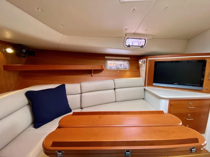 Slide: The Image of Luxurious interior of 2013 MJM 36z Downeast yacht with plush seating and wooden accents. - 29