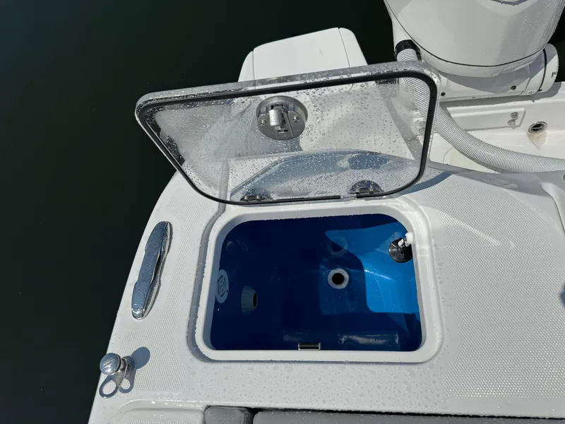 Slide: The Image of 2025 Everglades 285 Center Console livewell with open lid, showcasing interior. - 15