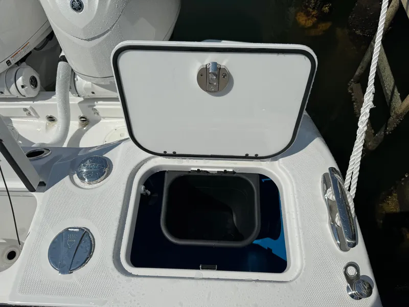 Slide: The Image of Open storage compartment on 2025 Everglades 285 Center Console boat. - 17