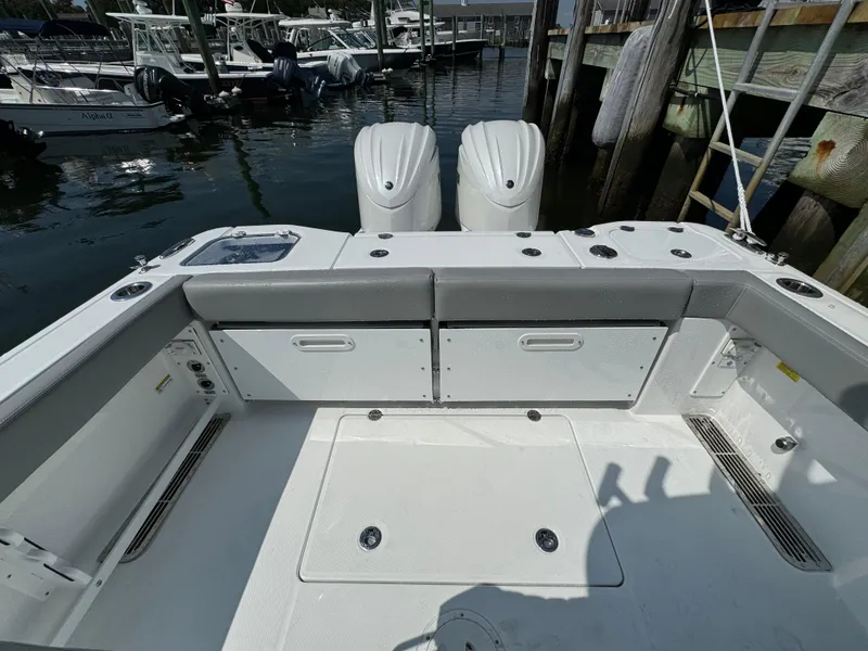 Slide: The Image of 2025 Everglades 285 Center Console boat with dual engines at dock. - 18