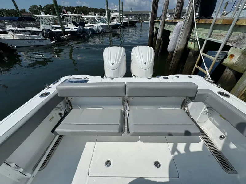 Slide: The Image of 2025 Everglades 285 Center Console boat docked at marina. - 19