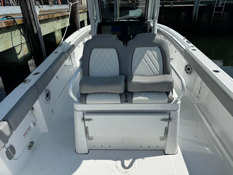 Slide: The Image of 2025 Everglades 285 Center Console boat with dual cushioned seats. - 26