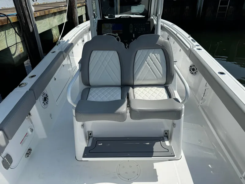 Slide: The Image of 2025 Everglades 285 Center Console boat with dual cushioned seats and modern dashboard. - 27