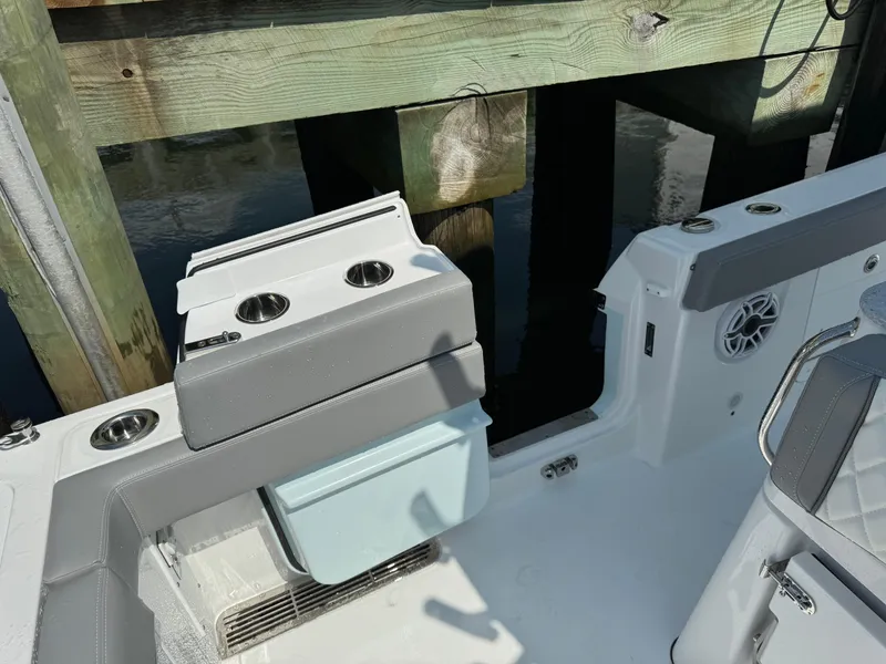 Slide: The Image of 2025 Everglades 285 Center Console boat interior with seating and cup holders. - 30