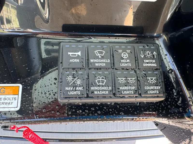 Slide: The Image of Control panel of 2025 Everglades 285 Center Console with various switches and labels. - 39