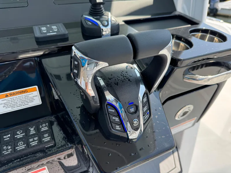 Slide: The Image of Throttle controls on 2025 Everglades 285 Center Console boat dashboard. - 40