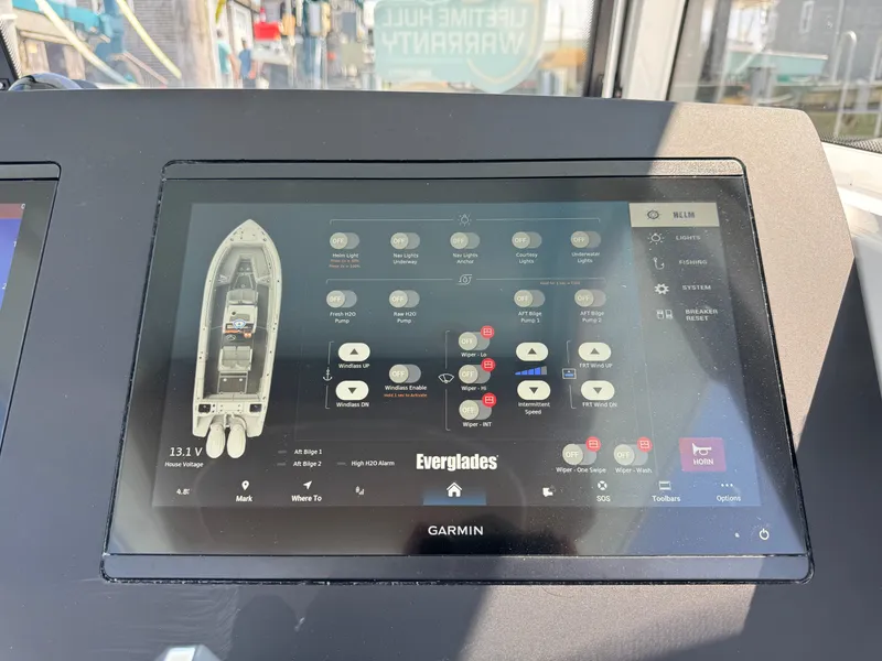 Slide: The Image of Garmin display on 2025 Everglades 285 Center Console boat dashboard. - 43