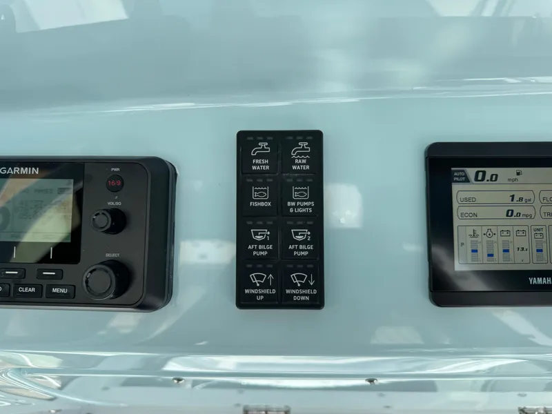 Slide: The Image of Control panel of 2025 Everglades 285 Center Console boat with Garmin and Yamaha displays. - 44