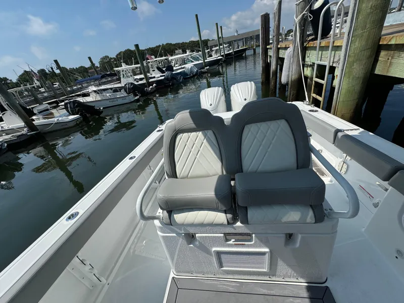 Slide: The Image of 2025 Everglades 285 Center Console boat with dual seats at marina. - 47