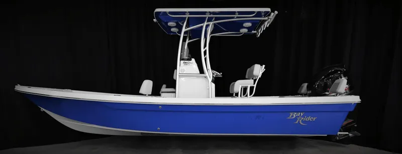 Slide: The Image of 2025 KenCraft 239 Bay Rider Bay boat, side view, blue hull, black background. - 7