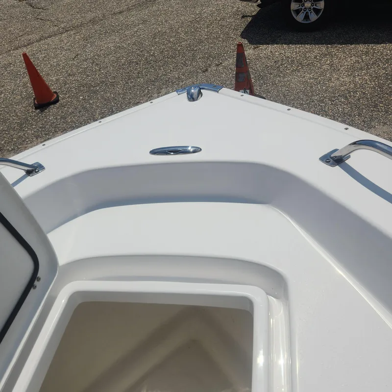 Slide: The Image of Bow of a 2020 Cape Horn 17 boat with open storage compartment. - 11