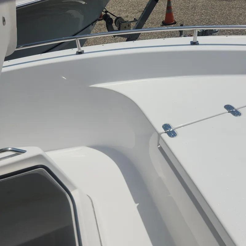 Slide: The Image of 2020 Cape Horn 17 boat deck with storage compartments and railing. - 13