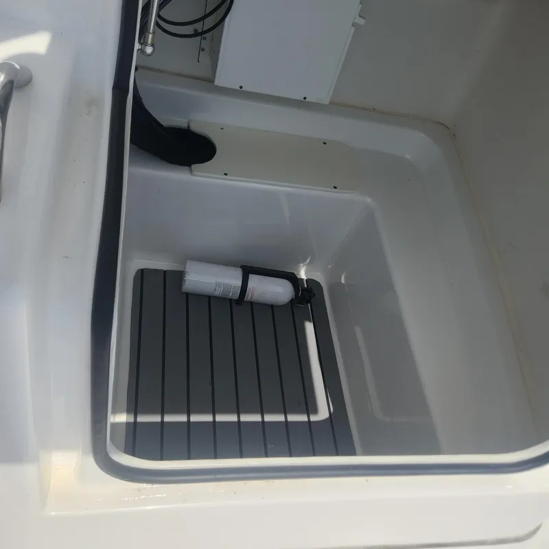Slide: The Image of Cape Horn 17 boat storage compartment with fire extinguisher, 2020 model. - 14