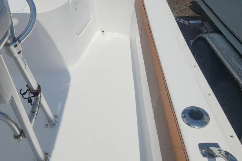 Slide: The Image of 2020 Cape Horn 17 boat interior with white deck and tan trim. - 19