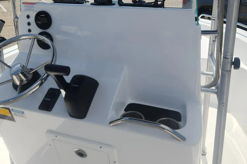 Slide: The Image of 2020 Cape Horn 17 boat console with steering wheel and controls. - 21