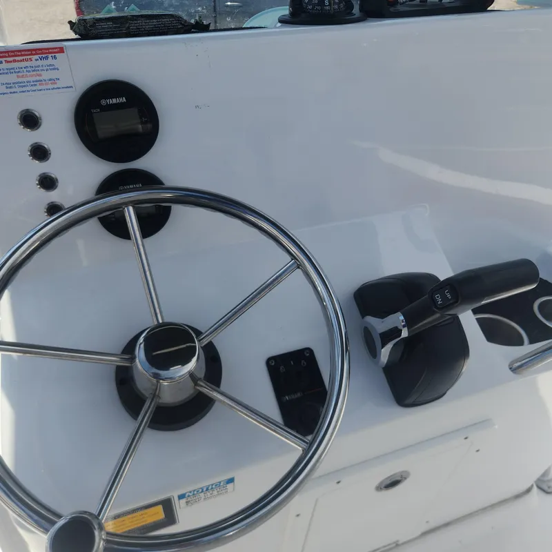 Slide: The Image of Cape Horn 17 boat console, steering wheel, and throttle controls, 2020 model. - 9