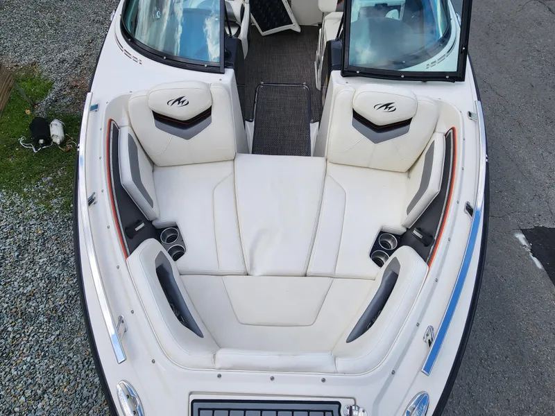 Slide: The Image of 2014 Monterey 234 Super Sport boat with white leather seating and open bow design. - 19