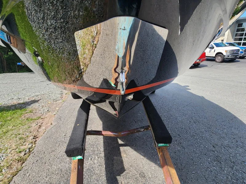 Slide: The Image of 2014 Monterey 234 Super Sport boat on a trailer, close-up of the hull. - 2