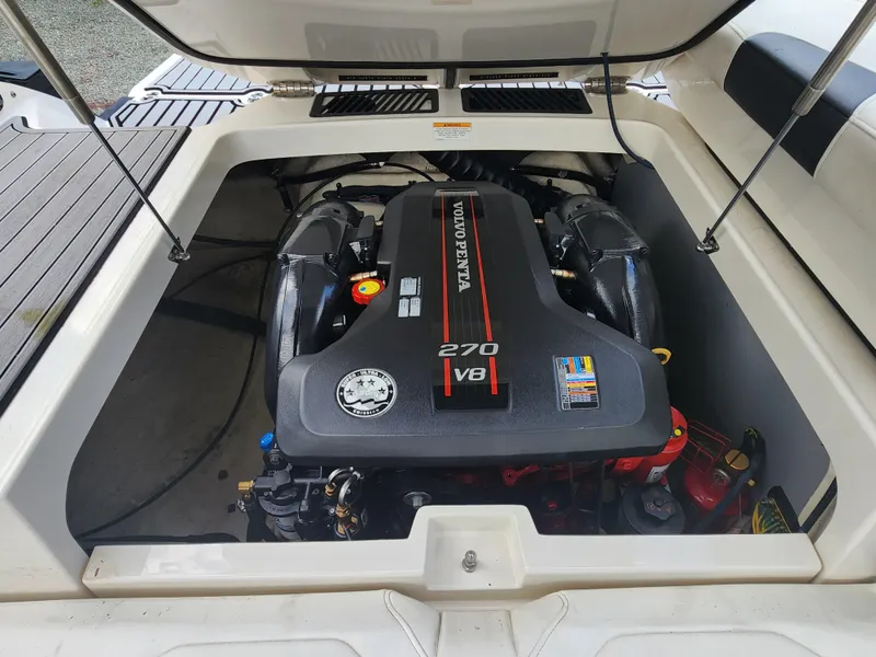 Slide: The Image of 2014 Monterey 234 Super Sport boat engine compartment with Volvo Penta 270 V8 engine. - 3