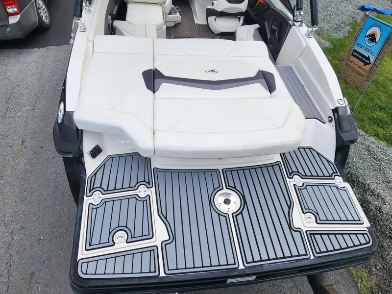 Slide: The Image of 2014 Monterey 234 Super Sport boat with white seating and gray deck. - 6