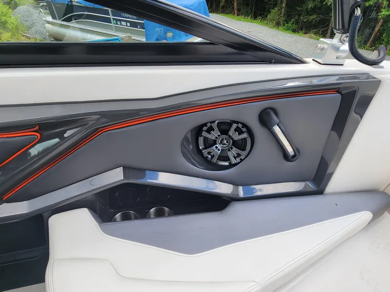 Slide: The Image of 2014 Monterey 234 Super Sport boat interior with speaker and cup holders. - 9