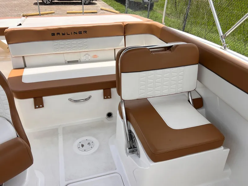 Slide: The Image of 2021 Bayliner VR5 Bowrider I/O interior with brown and white seating. - 12