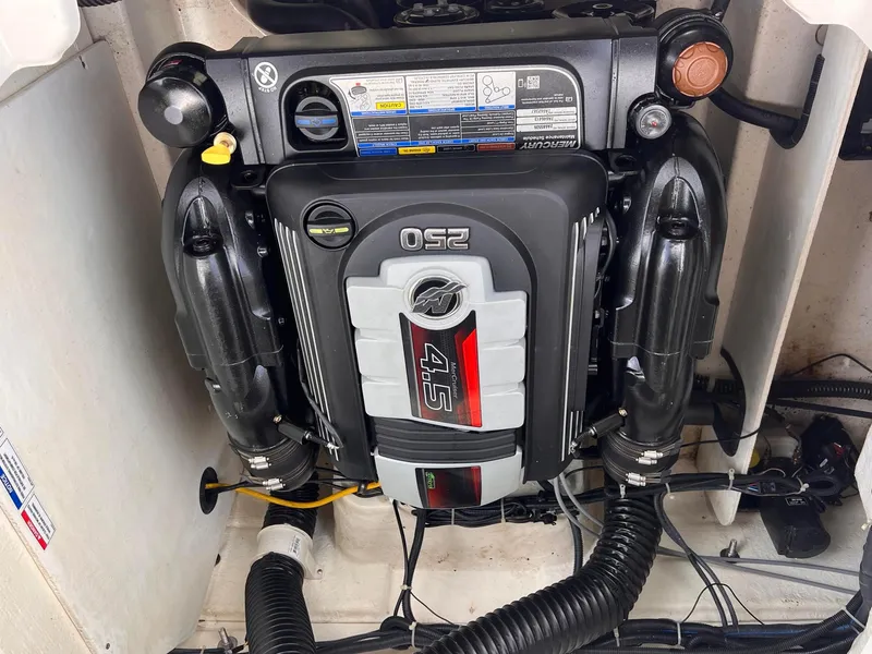 Slide: The Image of 2021 Bayliner VR5 Bowrider I/O engine compartment with 250 HP 4.5L MerCruiser engine. - 14