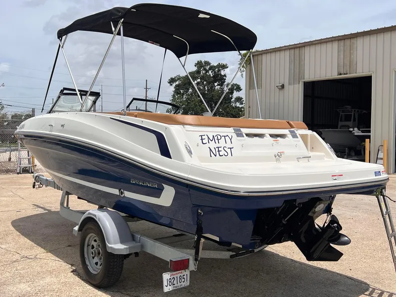 Slide: The Image of 2021 Bayliner VR5 Bowrider I/O boat on trailer, labeled Empty Nest. - 3