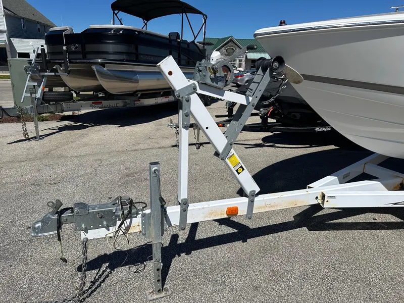 Slide: The Image of 2003 Cobalt 262 boat trailer hitch and winch system in a parking lot. - 10