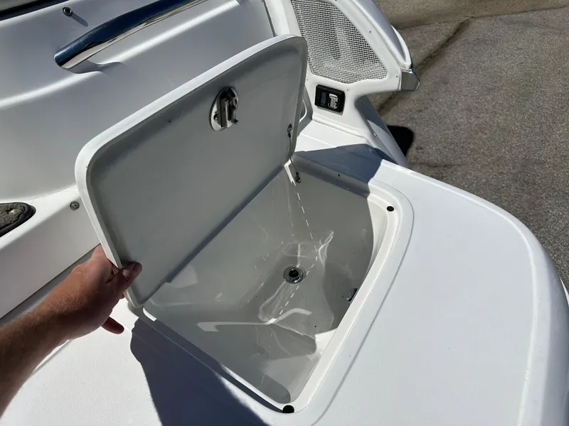 Slide: The Image of Open storage compartment on a 2003 Cobalt 262 boat. - 14