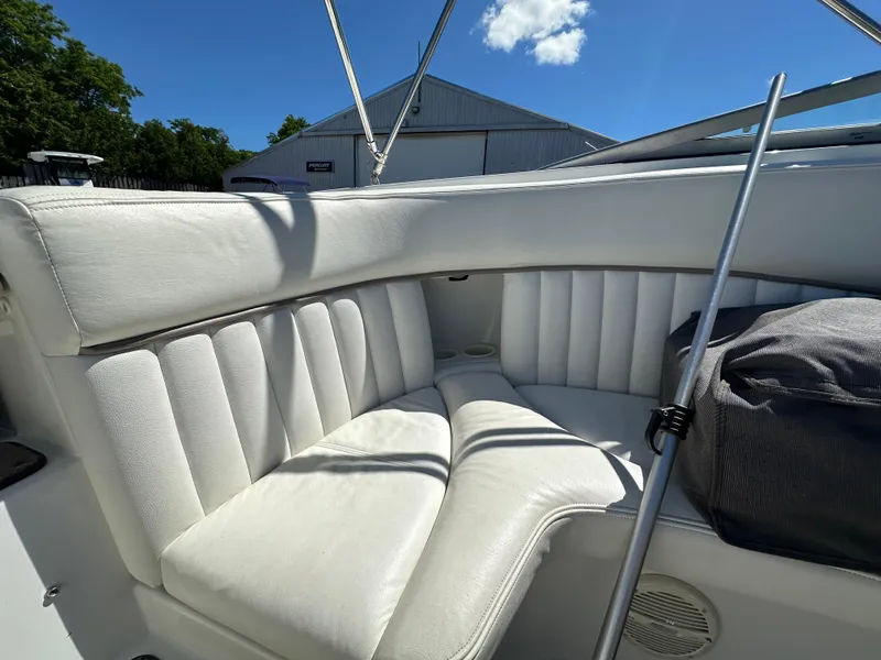 Slide: The Image of 2003 Cobalt 262 boat with white leather seating in the cockpit area. - 20