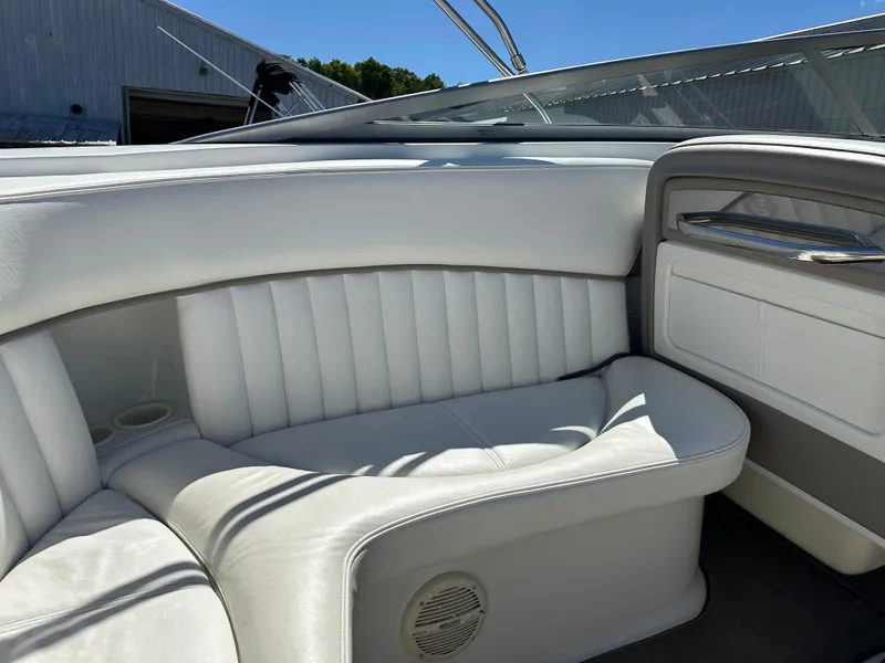 Slide: The Image of Interior seating of a 2003 Cobalt 262 boat with white upholstery. - 22