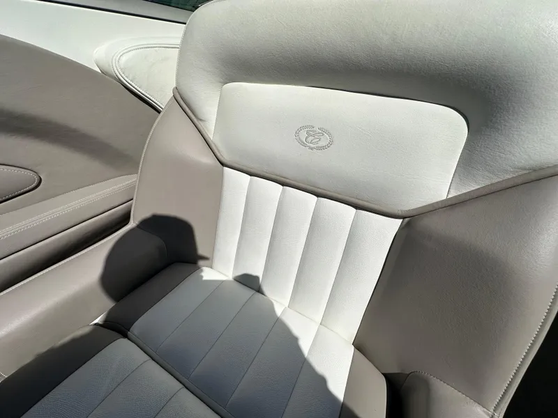 Slide: The Image of 2003 Cobalt 262 boat seat with beige and white upholstery. - 27