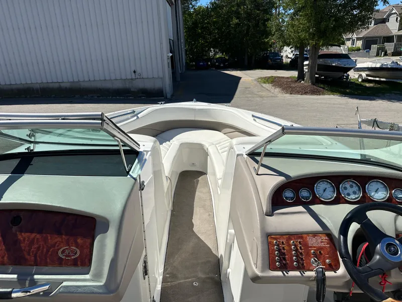 Slide: The Image of 2003 Cobalt 262 boat interior with dashboard and seating area. - 32