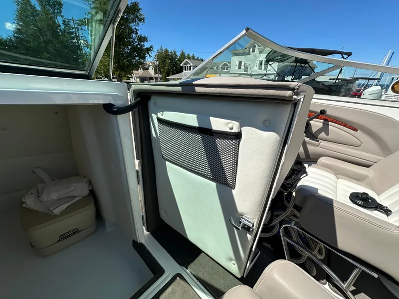 Slide: The Image of Interior of a 2003 Cobalt 262 boat with open storage compartment. - 43